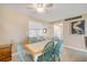 Comfortable dining area with seating for six with a tiled-top table and a lovely pelican artwork at 525 N Atlantic Ave # 39, New Smyrna Beach, FL 32169