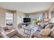 Spacious living room features a sliding door with a view, adjacent to a bedroom at 525 N Atlantic Ave # 39, New Smyrna Beach, FL 32169