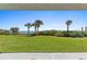 Beautiful backyard with a lush green lawn and stunning ocean view at 5301 S Atlantic Ave # 140, New Smyrna Beach, FL 32169