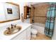 Bathroom with a unique sink, mirror, and walk-in shower at 5301 S Atlantic Ave # 140, New Smyrna Beach, FL 32169