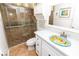 Bathroom featuring unique sink and countertop with walk-in shower at 5301 S Atlantic Ave # 140, New Smyrna Beach, FL 32169