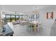 Bright living and dining area with sliding glass doors to a patio at 5301 S Atlantic Ave # 140, New Smyrna Beach, FL 32169