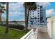Inviting community pool surrounded by lush landscaping and condo buildings, perfect for relaxation at 5301 S Atlantic Ave # 140, New Smyrna Beach, FL 32169