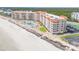 Stunning aerial view of beachfront condos with pools, putting green, beach and easy parking at 5501 S Atlantic Ave # 4090, New Smyrna Beach, FL 32169
