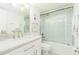 Clean, bright bathroom with white subway tile shower, marble countertop, and stylish fixtures at 5501 S Atlantic Ave # 4090, New Smyrna Beach, FL 32169