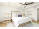 Comfortable bedroom featuring a ceiling fan, bright natural light, and stylish decor at 5501 S Atlantic Ave # 4090, New Smyrna Beach, FL 32169