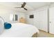 Bright bedroom with large closets, a ceiling fan, and an exterior view from the window at 5501 S Atlantic Ave # 4090, New Smyrna Beach, FL 32169