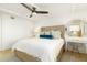 Well lit bedroom featuring stylish decor, a comfortable bed, and bright natural lighting at 5501 S Atlantic Ave # 4090, New Smyrna Beach, FL 32169