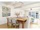 Comfortable dining room featuring modern chandelier and accents with views of the ocean at 5501 S Atlantic Ave # 4090, New Smyrna Beach, FL 32169