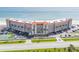 Stunning aerial view of beachfront condos with tennis court, easy parking and ocean views at 5501 S Atlantic Ave # 4090, New Smyrna Beach, FL 32169