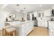 Bright, renovated kitchen featuring a large island with seating and stainless steel appliances at 5501 S Atlantic Ave # 4090, New Smyrna Beach, FL 32169