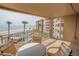 Relaxing condo patio with ocean views, ideal for enjoying the coastal breeze and overlooking the beach at 5501 S Atlantic Ave # 4090, New Smyrna Beach, FL 32169