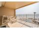 Charming condo patio with stylish furniture offering beautiful views of the ocean and pool area at 5501 S Atlantic Ave # 4090, New Smyrna Beach, FL 32169