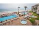 Beautiful oceanfront pool and kiddie pool with lounge chairs, perfect for a relaxing vacation at 5501 S Atlantic Ave # 4090, New Smyrna Beach, FL 32169