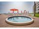 Sparkling kiddie pool with ocean views, surrounded by lounge chairs and lush landscaping at 5501 S Atlantic Ave # 4090, New Smyrna Beach, FL 32169