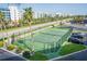 Enjoy a match at the community tennis court with palm trees and nearby parking at 5501 S Atlantic Ave # 4090, New Smyrna Beach, FL 32169