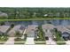 Beautiful waterfront home featuring a well-manicured lawn, long driveway and a two car garage at 551 Armoyan Way, New Smyrna Beach, FL 32168