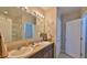Bathroom with dual sinks, granite countertops, and ample lighting at 551 Armoyan Way, New Smyrna Beach, FL 32168
