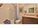 Bathroom with shower, tub, and granite-topped vanity at 551 Armoyan Way, New Smyrna Beach, FL 32168
