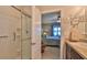 En-suite bathroom with glass shower, well-lit vanity, and easy access to the main bedroom at 551 Armoyan Way, New Smyrna Beach, FL 32168