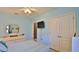 Comfortable bedroom with a ceiling fan, closet, and dresser at 551 Armoyan Way, New Smyrna Beach, FL 32168