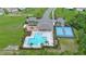 Aerial view of the community pool, community center and playground in this neighborhood at 551 Armoyan Way, New Smyrna Beach, FL 32168