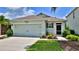 Charming single-story home featuring a two-car garage and well-maintained landscaping at 551 Armoyan Way, New Smyrna Beach, FL 32168