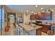 Open kitchen design featuring a large island with seating and stainless steel appliances at 551 Armoyan Way, New Smyrna Beach, FL 32168