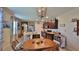 Open kitchen and breakfast nook features a large island, stainless appliances, and stylish decor at 551 Armoyan Way, New Smyrna Beach, FL 32168