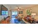 Inviting living room with stylish furnishings and sliding glass doors leading to an outdoor space at 551 Armoyan Way, New Smyrna Beach, FL 32168