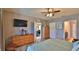 Spacious main bedroom with an en-suite bathroom and walk-in closet, offering ample storage at 551 Armoyan Way, New Smyrna Beach, FL 32168