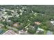 Aerial view showing property location among trees, homes, and neighborhood. The arrows indicate landmarks at 585 Corbin Park Rd, New Smyrna Beach, FL 32168