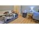 Inviting bedroom features a cozy bed, desk area, and ample storage, creating a comfortable and functional living space at 585 Corbin Park Rd, New Smyrna Beach, FL 32168