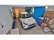 Spacious garage with bright lighting, storage, and space for a vehicle at 585 Corbin Park Rd, New Smyrna Beach, FL 32168