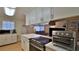 Kitchen featuring white cabinetry, updated countertops, and modern stainless-steel appliances at 585 Corbin Park Rd, New Smyrna Beach, FL 32168