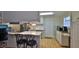 Open kitchen layout with stainless steel appliances and white cabinets at 585 Corbin Park Rd, New Smyrna Beach, FL 32168