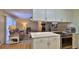 Open kitchen view to living area featuring stone fireplace at 585 Corbin Park Rd, New Smyrna Beach, FL 32168