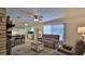 Bright living room with modern furnishings and ceiling fan at 585 Corbin Park Rd, New Smyrna Beach, FL 32168