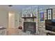 Living room with stone fireplace and a view of the kitchen at 585 Corbin Park Rd, New Smyrna Beach, FL 32168