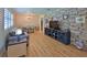 Inviting living room flowing into the dining area, showcasing hardwood floors and stylish decor at 585 Corbin Park Rd, New Smyrna Beach, FL 32168