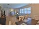 Bright, open-concept living space with dining area, natural light, and seamless flow at 585 Corbin Park Rd, New Smyrna Beach, FL 32168
