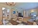 Combined living and dining area with stylish decor and a smooth transition between spaces at 585 Corbin Park Rd, New Smyrna Beach, FL 32168