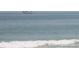 Tranquil ocean view of a sailboat on the open sea with gentle waves at 585 Corbin Park Rd, New Smyrna Beach, FL 32168