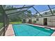 Enjoy outdoor living with a refreshing screened-in pool, perfect for relaxation at 585 Corbin Park Rd, New Smyrna Beach, FL 32168