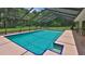 Enjoy swimming in a large screened-in pool with a spacious deck for lounging and entertaining at 585 Corbin Park Rd, New Smyrna Beach, FL 32168