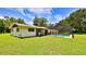 A backyard with a screened in private pool perfect for relaxation and summer fun at 585 Corbin Park Rd, New Smyrna Beach, FL 32168