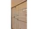 Modern shower showcasing glass doors, updated fixtures, and built-in shelving for convenience at 585 Corbin Park Rd, New Smyrna Beach, FL 32168