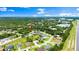 Aerial view showcasing the property's location nestled in a lush, green neighborhood near the highway at 5935 Shady Creek Ln, Port Orange, FL 32128