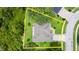 Aerial view of the property showing landscaping with well-maintained lawn, and a defined property line at 5935 Shady Creek Ln, Port Orange, FL 32128