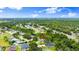 Aerial view of the property showcasing its location near a highway, lake, and other residential homes at 5935 Shady Creek Ln, Port Orange, FL 32128